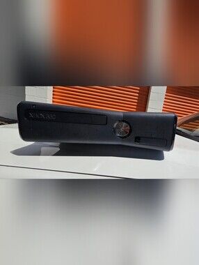 Microsoft Xbox 360 S (Slim) console, featuring a sleek black